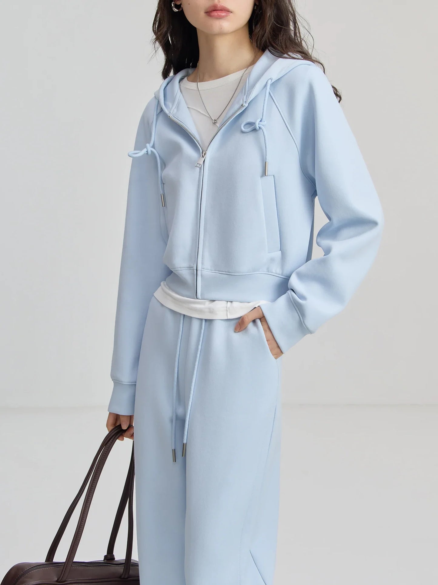 Fashionable women's sweater suit set with cardigan and pants