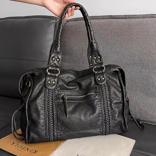 Rachel's black school handbag
- TrendAura