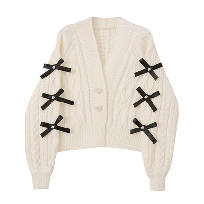 Fashionable knit cardigan with bow details