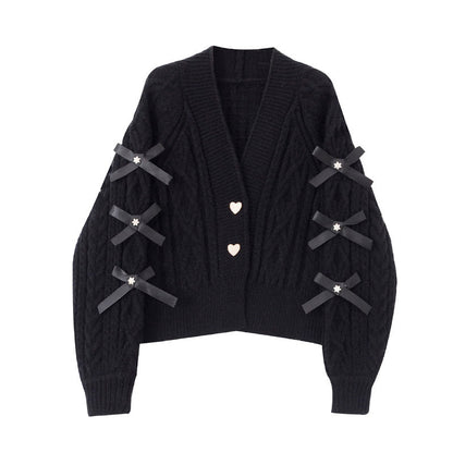 Fashionable knit cardigan with bow details