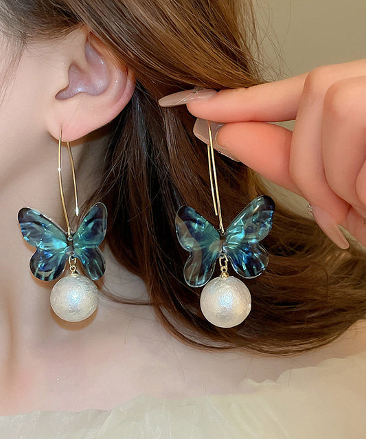 Boucles d'oreilles créoles en acrylique bleu avec perles et papillon - TrendAura