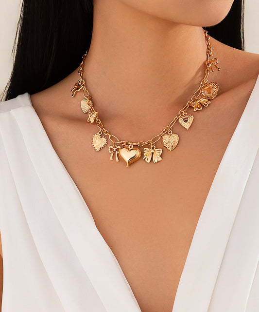 Collier avec pendentif en forme de nœud d'amour en alliage de cuivre doré - TrendAura