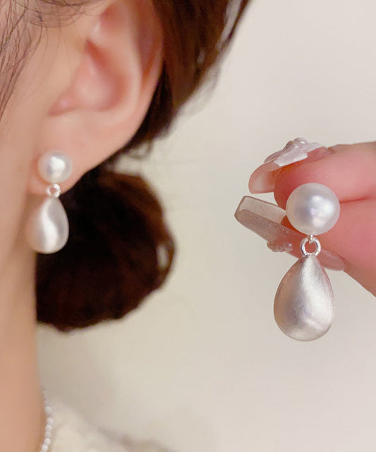 Boucles d'oreilles pendantes en or 14 carats avec perles et cuivre blanc Ovegild - TrendAura