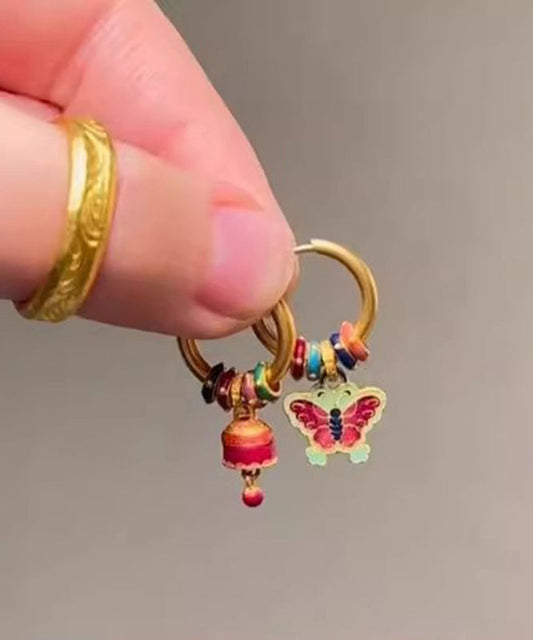 Boucles d'oreilles pendantes asymétriques en forme de cloche papillon en or antique chic - TrendAura