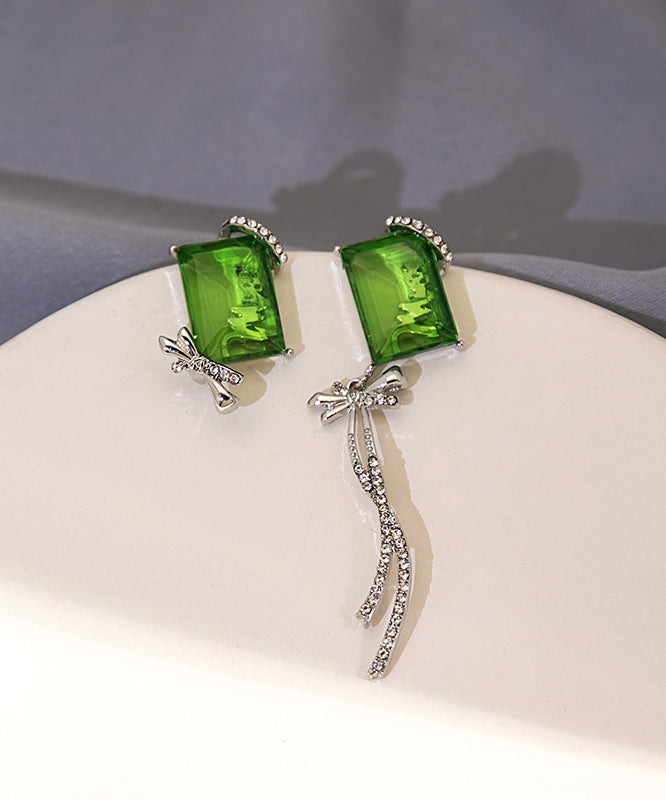 Boucles d'oreilles pendantes chics asymétriques en cuivre vert et zircon, avec nœud papillon et pompon - TrendAura