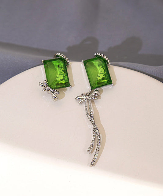 Boucles d'oreilles pendantes chics asymétriques en cuivre vert et zircon, avec nœud papillon et pompon - TrendAura