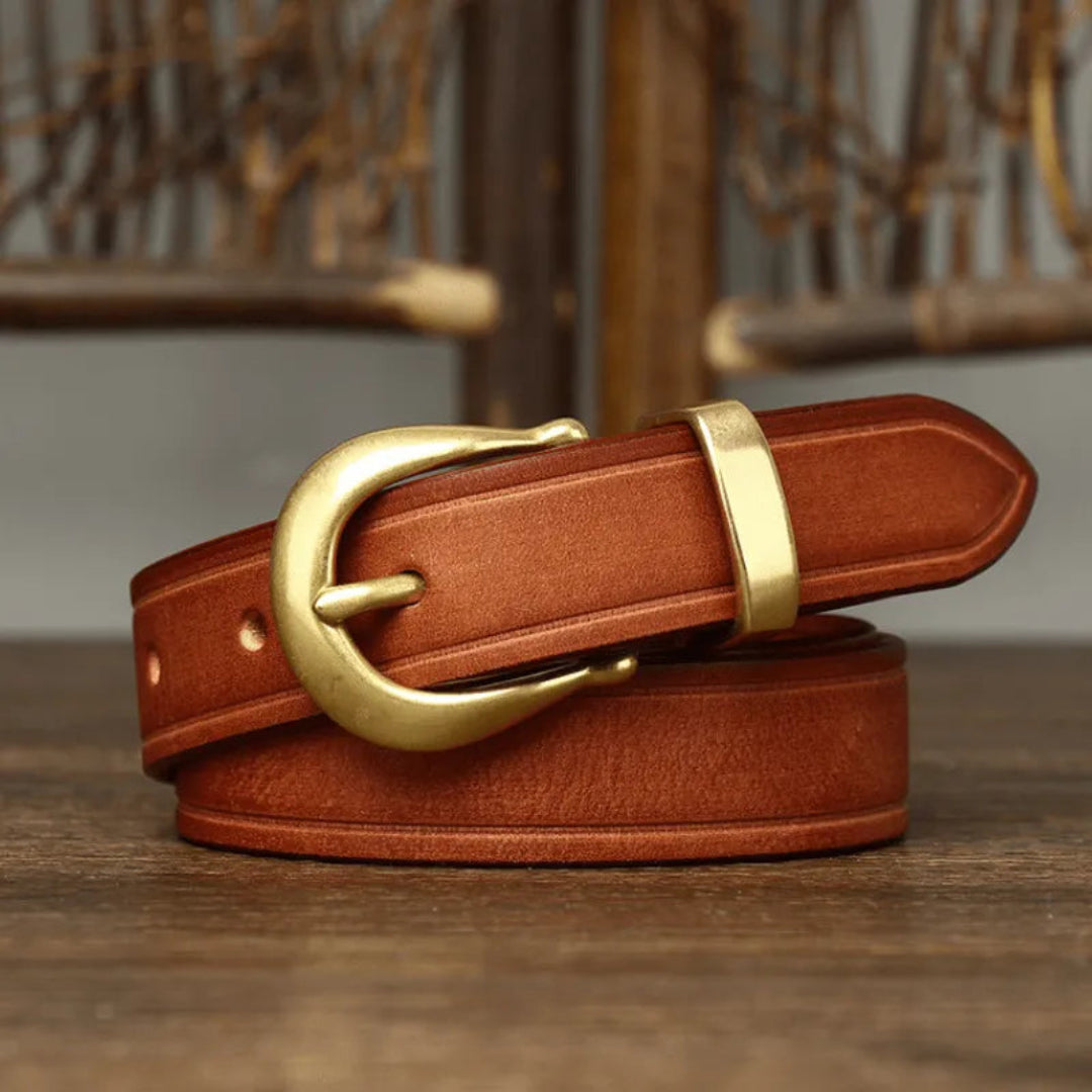 Elegant belt made of full-grain leather with curved brass buckle