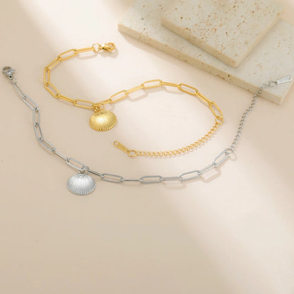 Elegant women's bracelet made of stainless steel with shell pendant in color