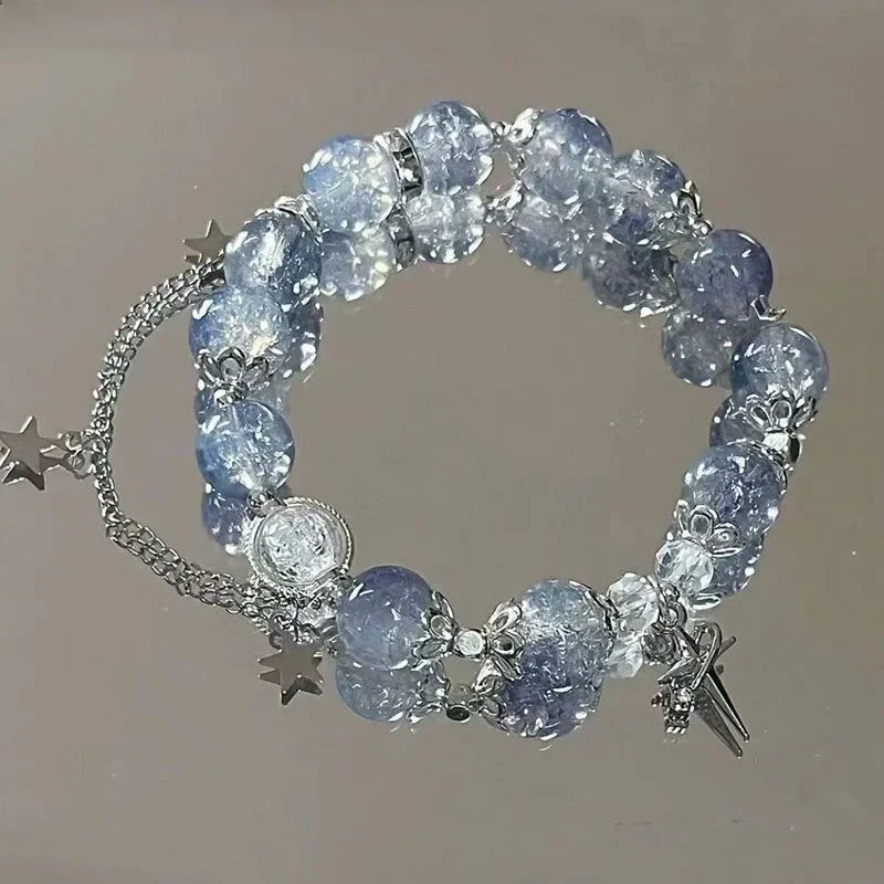 Elegant bracelet for women with star pendant and blue crystal beads