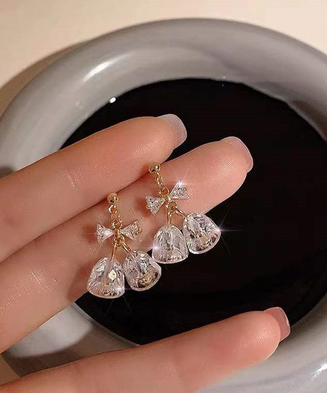 Boucles d'oreilles pendantes en zircon doré et cuivré, style tendance, avec nœud et clochette. - TrendAura