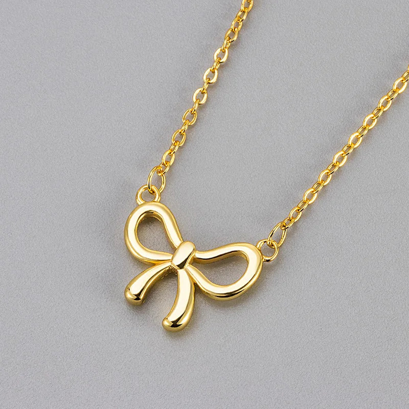 Women's copper necklace with cutout bow design