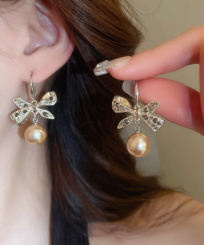 Boucles d'oreilles pendantes modernes en alliage de cuivre et zircon, avec perles et nœud en forme de nœud, couleur champagne - TrendAura