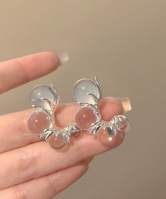 Boucles d'oreilles créoles asymétriques en résine cuivrée et nude modernes en forme de C - TrendAura