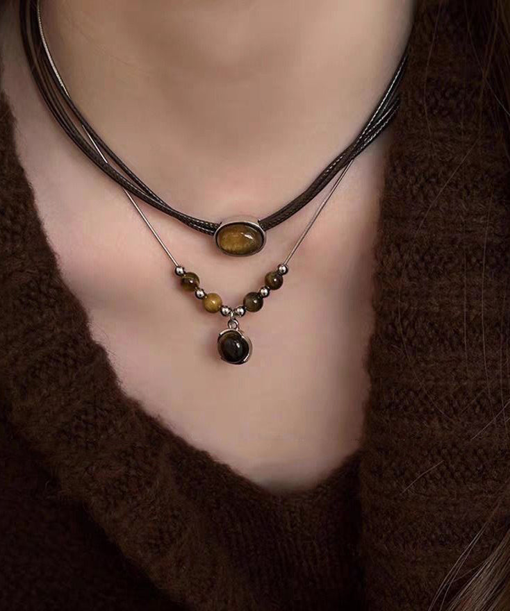 Ensemble de deux colliers pendentifs œil de tigre en patchwork de cuir neuf - TrendAura