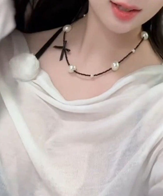 Collier original en acier inoxydable noir avec perles et nœud - TrendAura