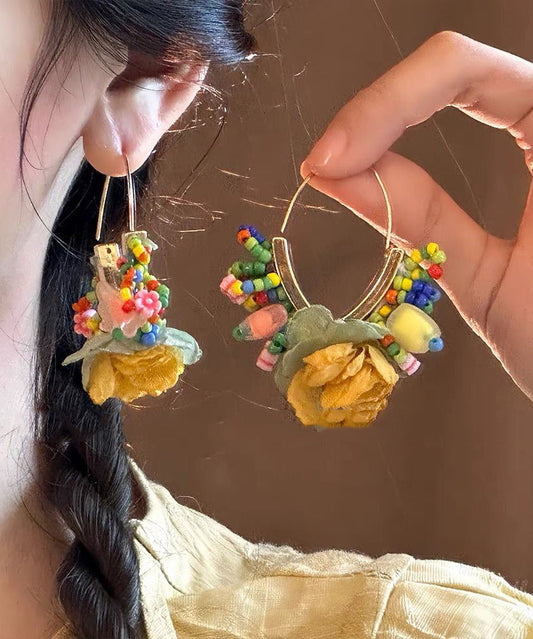 Boucles d'oreilles créoles florales en perles de tulle dorées et cuivrées au design original - TrendAura