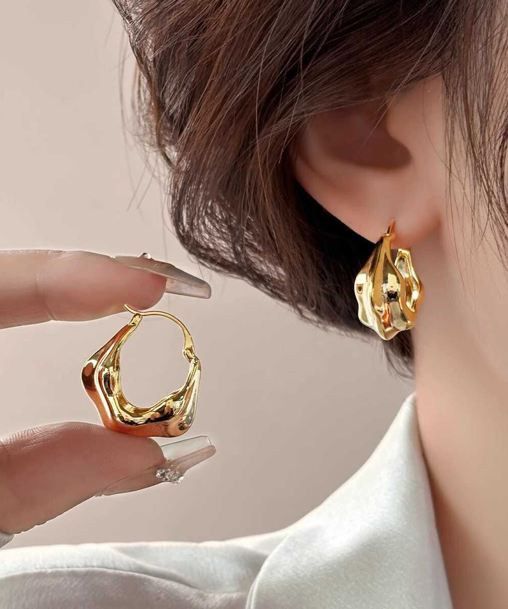 Boucles d'oreilles créoles en métal doré au design original - TrendAura