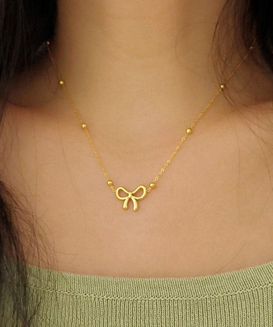 Collier élégant avec pendentif nœud en acier inoxydable doré - TrendAura