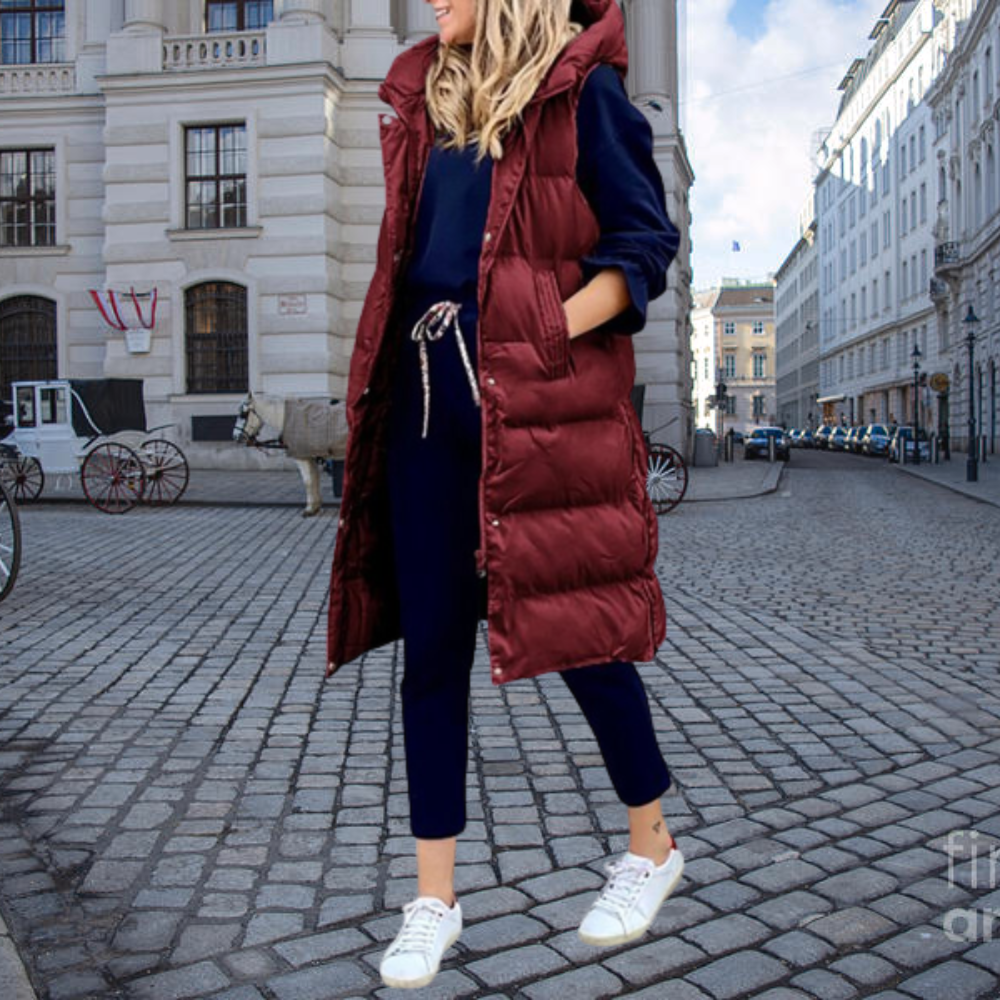 Riley - Long padded vest with hood and pockets