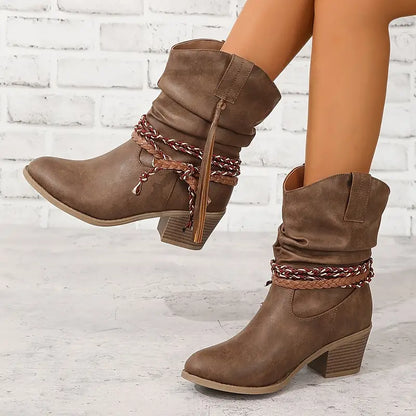 Women's cowboy boots with decorative lacing and fringes