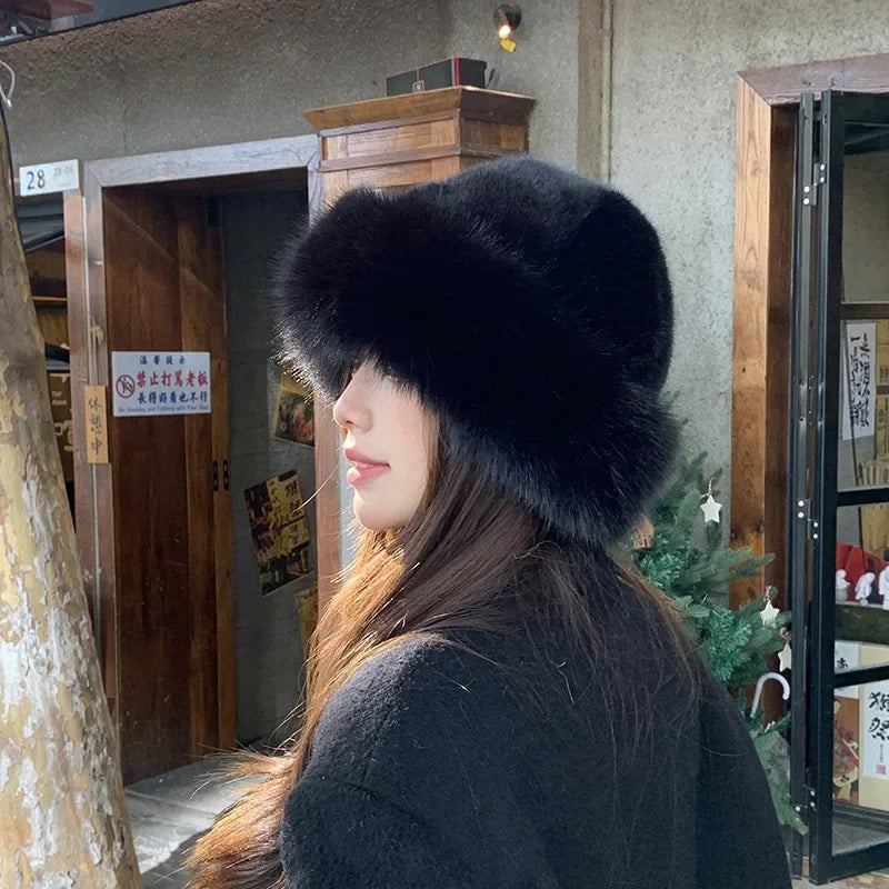 Warmer women's fur hat made of faux fur for autumn and winter