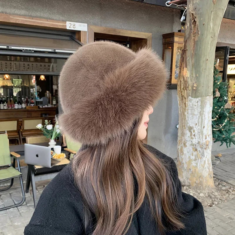 Warmer women's fur hat made of faux fur for autumn and winter