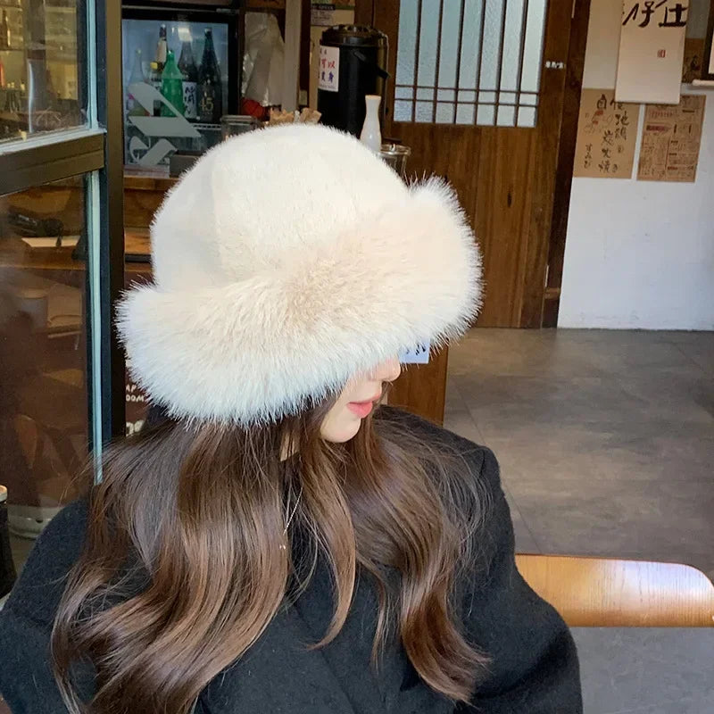 Warmer women's fur hat made of faux fur for autumn and winter