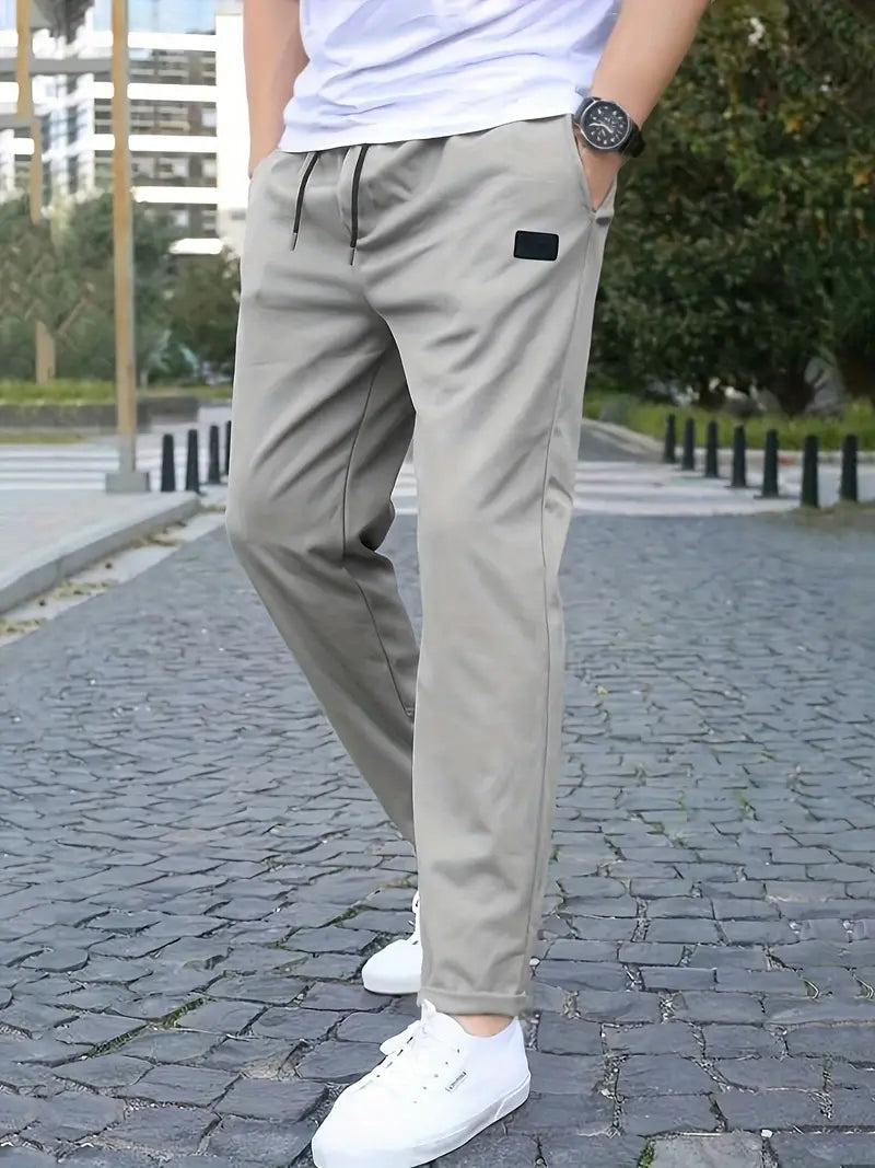 Stretch jogging pants, sporty and fashionable, with drawstring and relaxed waist