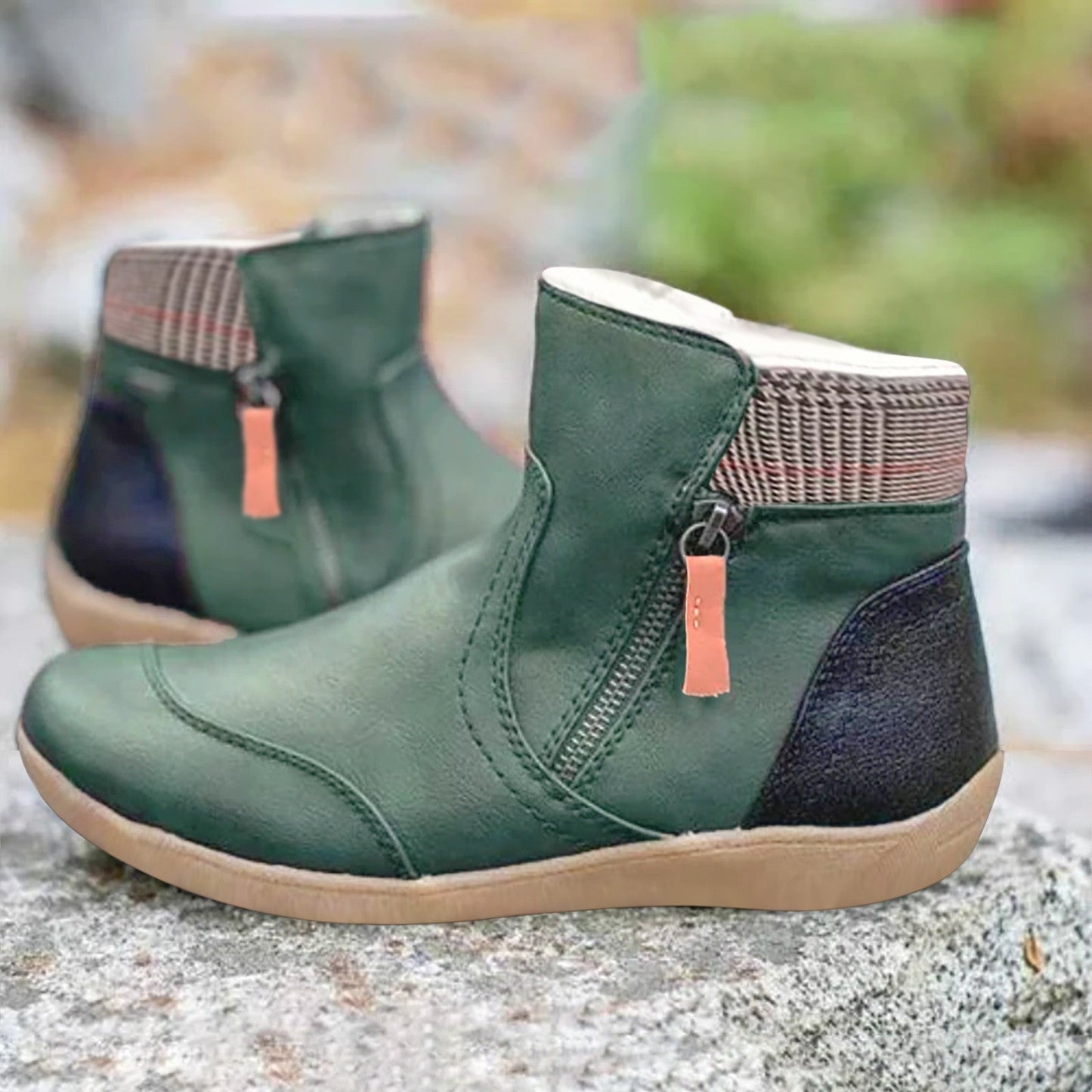 Black ankle boots with a zipper, insulation, and checkered detailing