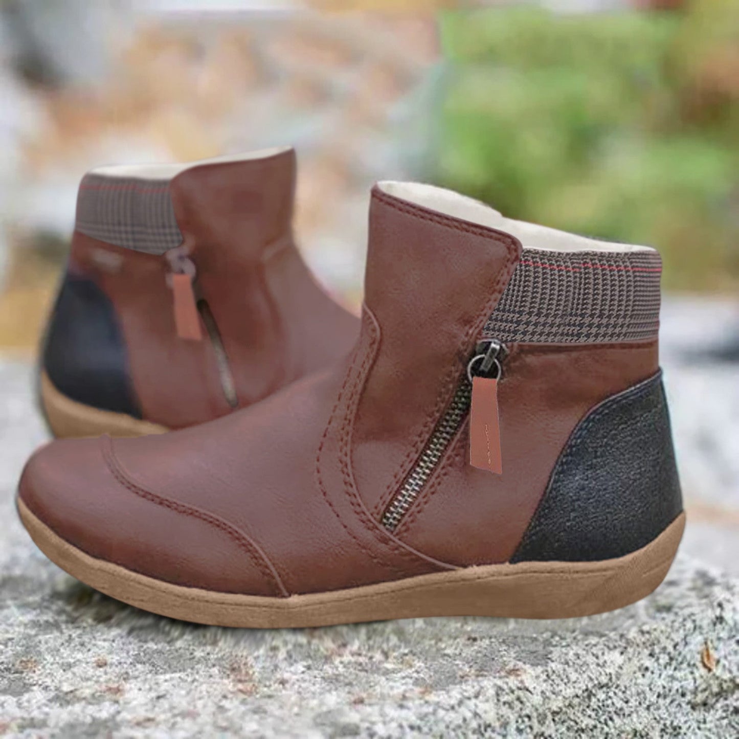 Black ankle boots with a zipper, insulation, and checkered detailing
